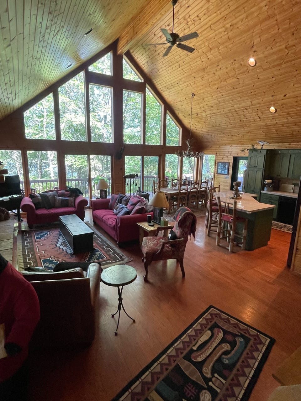 Main floor overlooking lake with seating on large deck