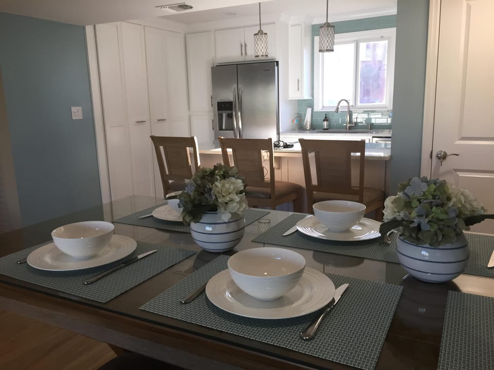 Bar stools fit around high top table to add more seating.