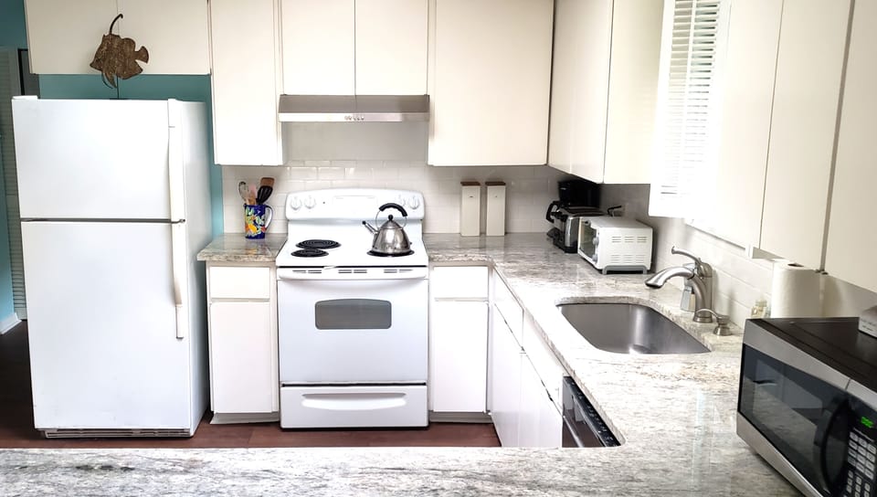 Our original but recently updated kitchen. We love to cook around here!