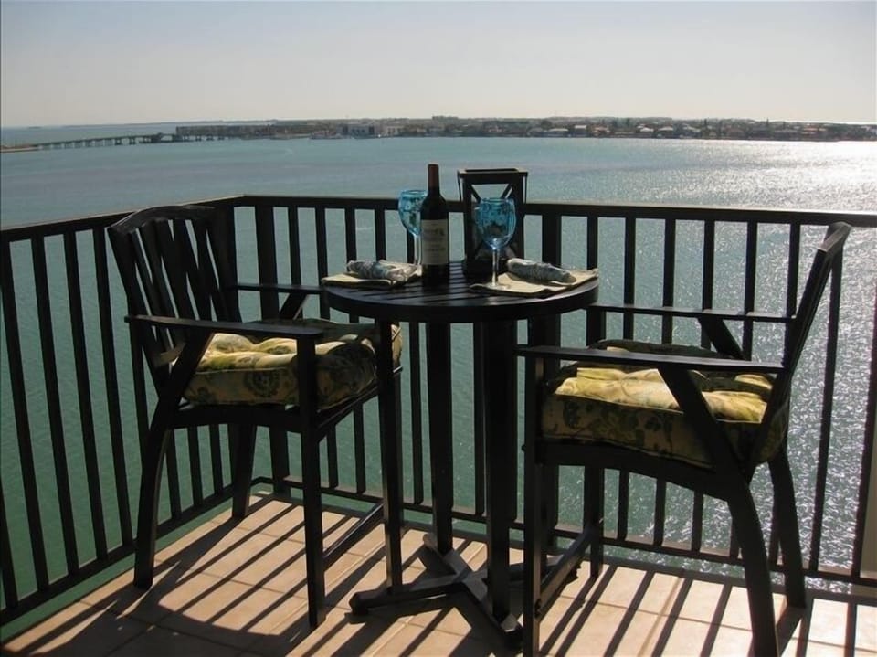 Boca Ciega Bay sparkles as you enjoy a refreshing drink at our  new bistro set
