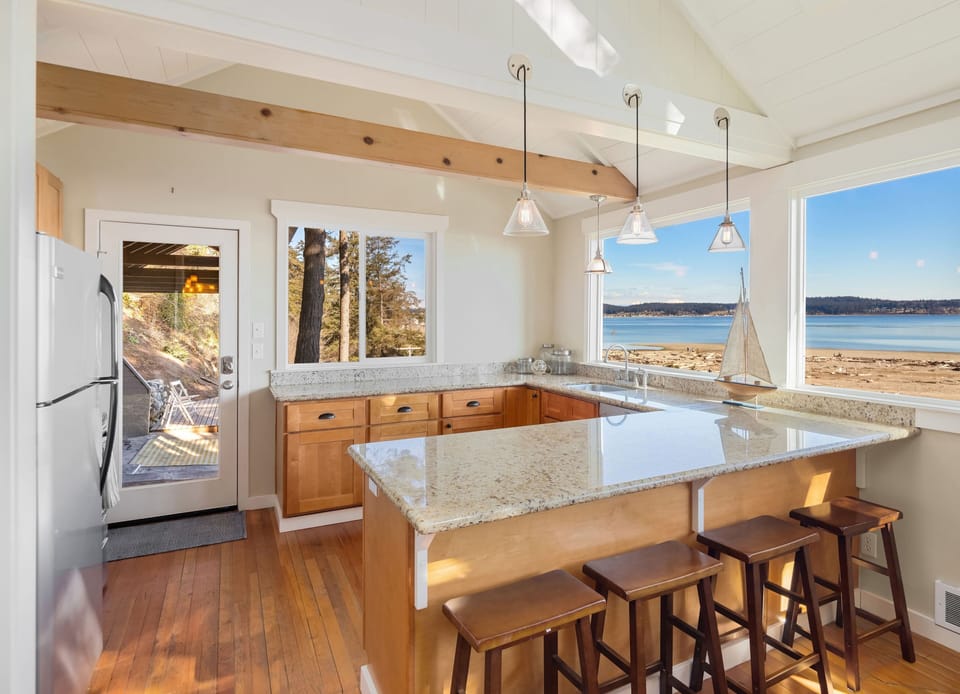 Clean and simple kitchen with granite counters.