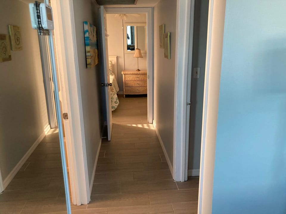 Hall from living/dining rms to first master on rt, or straight to family master!