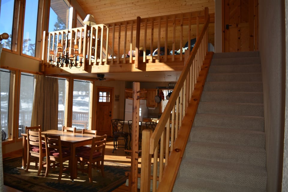 dining area, stairs that lead to loft/master bed and bath 