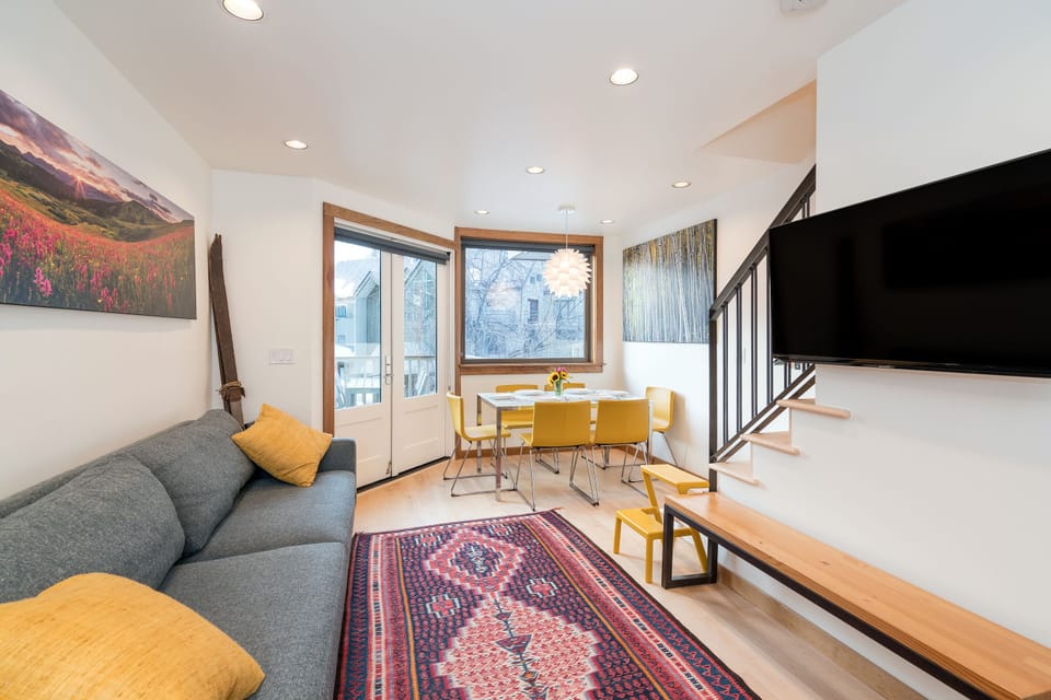 2nd Floor: open-plan living, dining, kitchen & bar area with access to deck.
