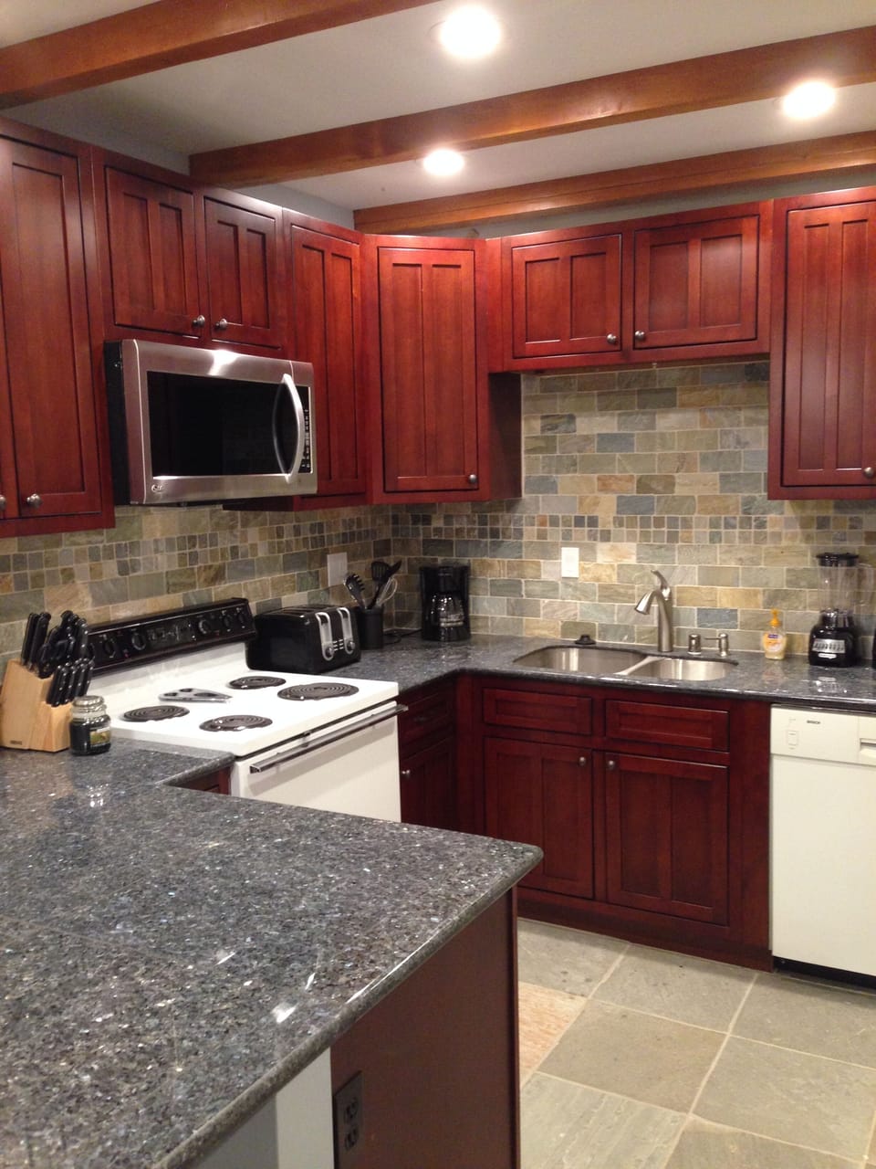 Remodeled Kitchen with new cabinets, counter tops and back splash.