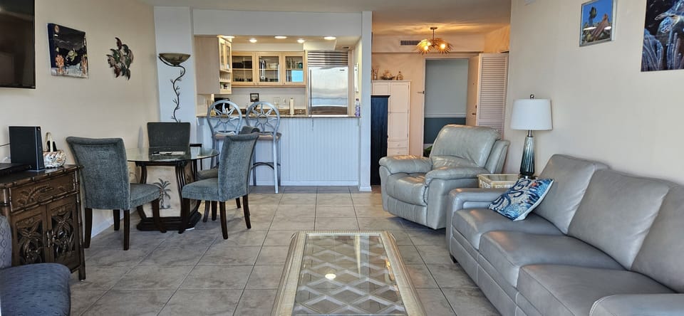 Large living room with view to watch boats and smart TV.
