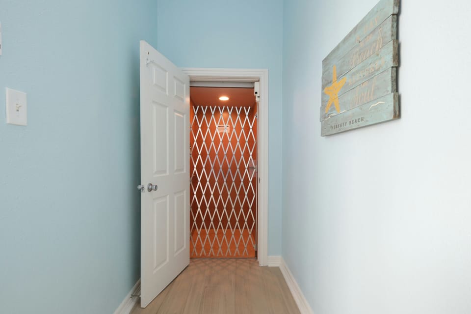 Ground level elevator room w/the elevator.