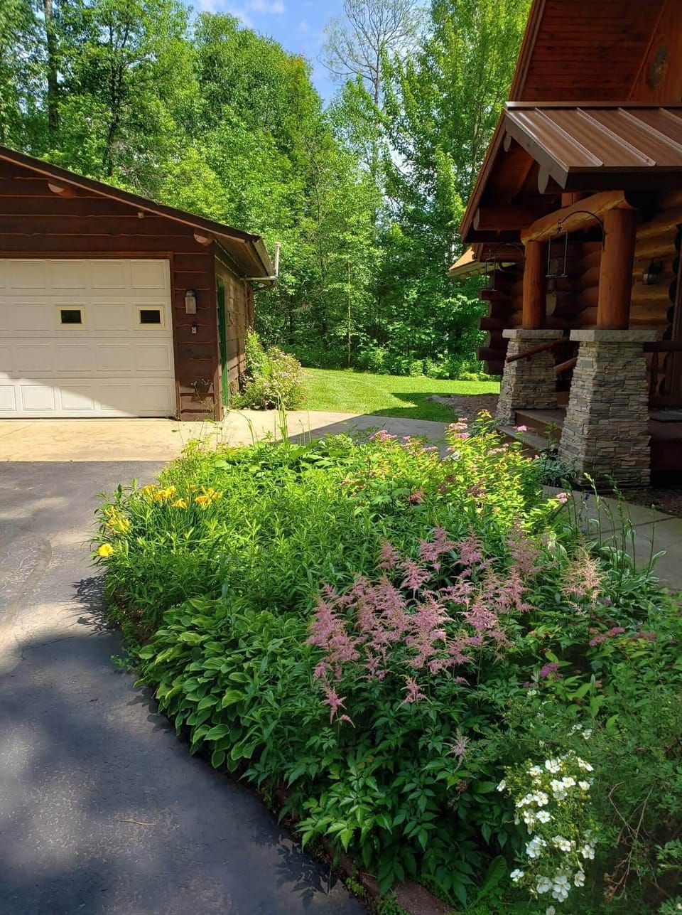 Two car garage which guests can fit one car in.