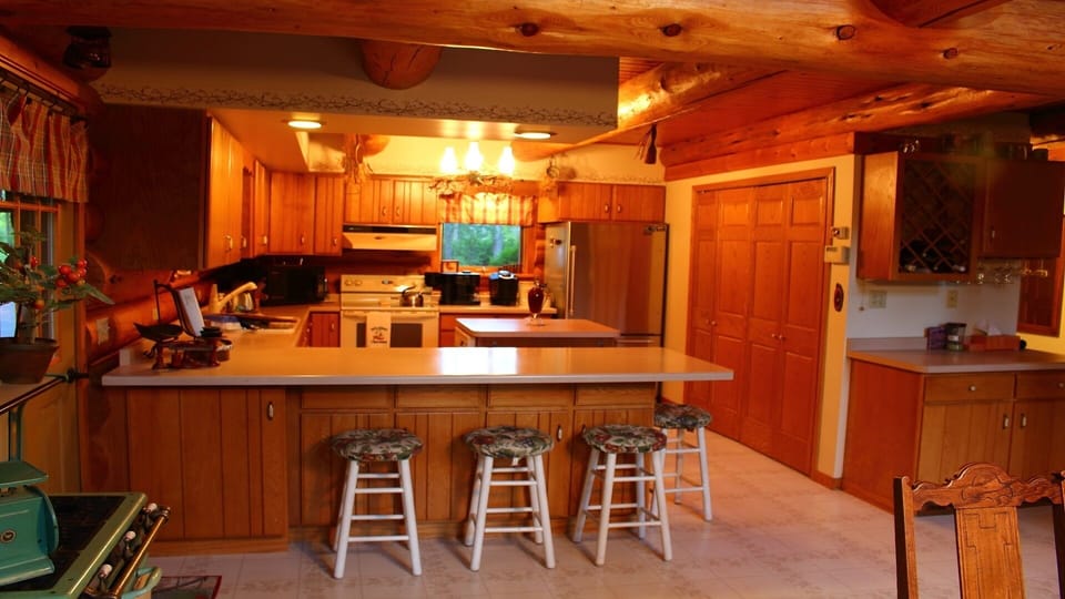 General kitchen photo (with old floor and stools.)  We need to update this one.