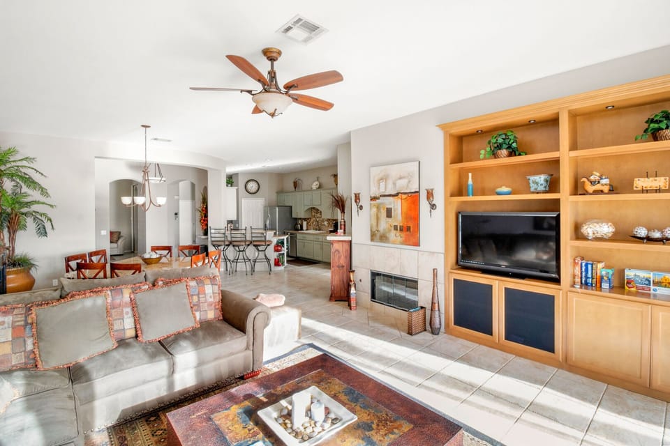 Open floor plan with kitchen, dinning and family room looking over the greens