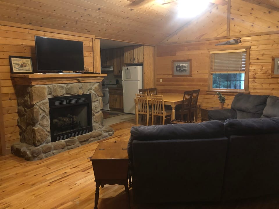 Living room/dining room area with gas fireplace