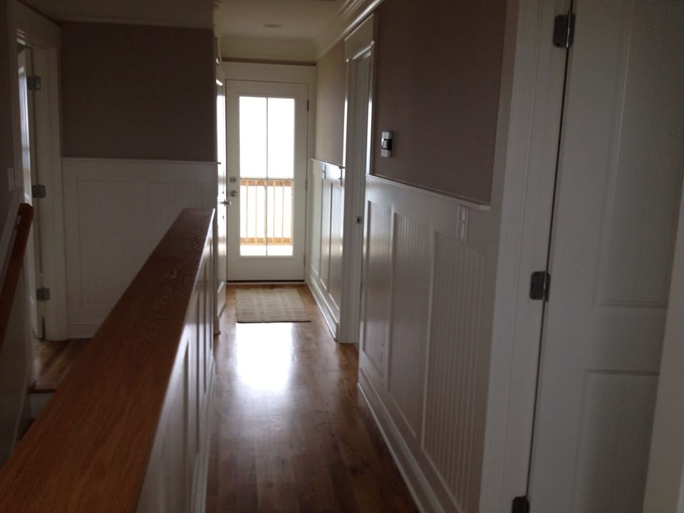 Upstairs hallway leading to laundry area and top deck