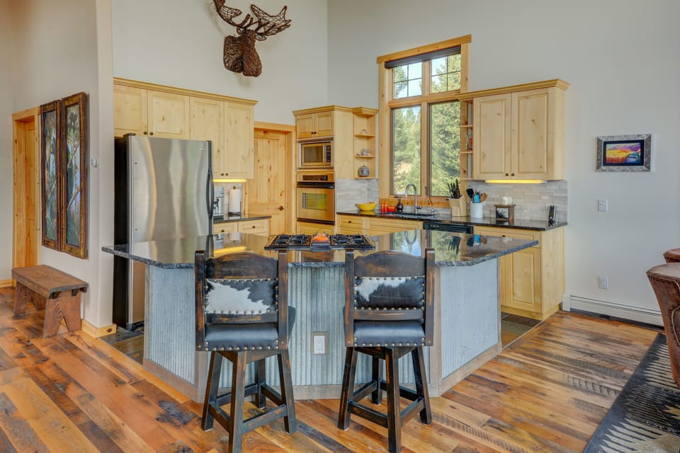 Stainless Appliances, Custom Island and Reclaimed Wood Flooring