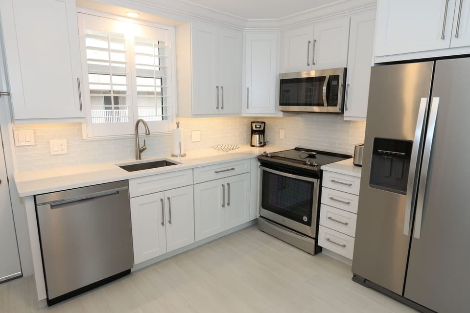 Fully equipped kitchen with stainless steel appliances. 