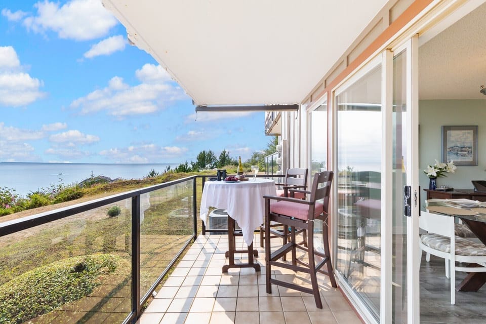 Large covered balcony with room for Grilling and eating, and hanging out. 