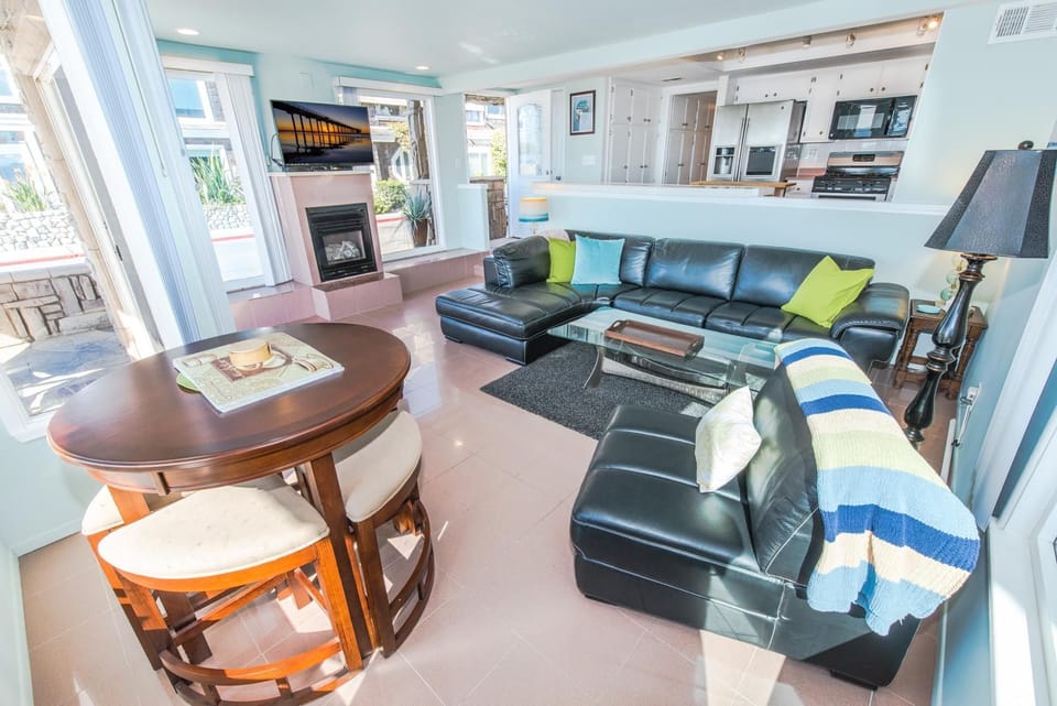 The front door opens to the kitchen on your left and main living area to your right. (Fireplace is non-operational).
                