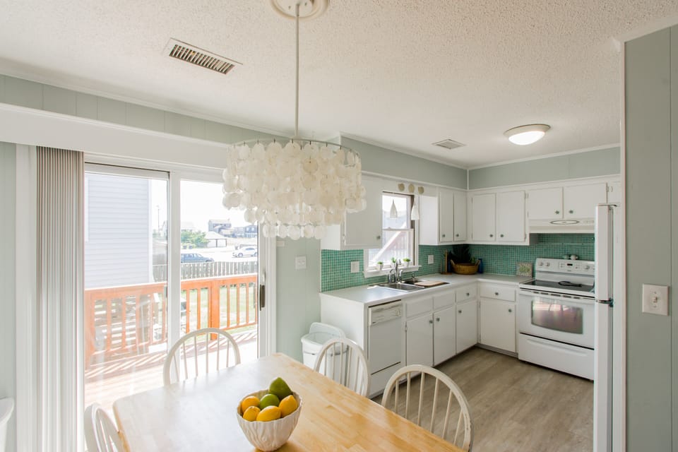 Kitchen w/ Eat In Area and direct access to deck and grill