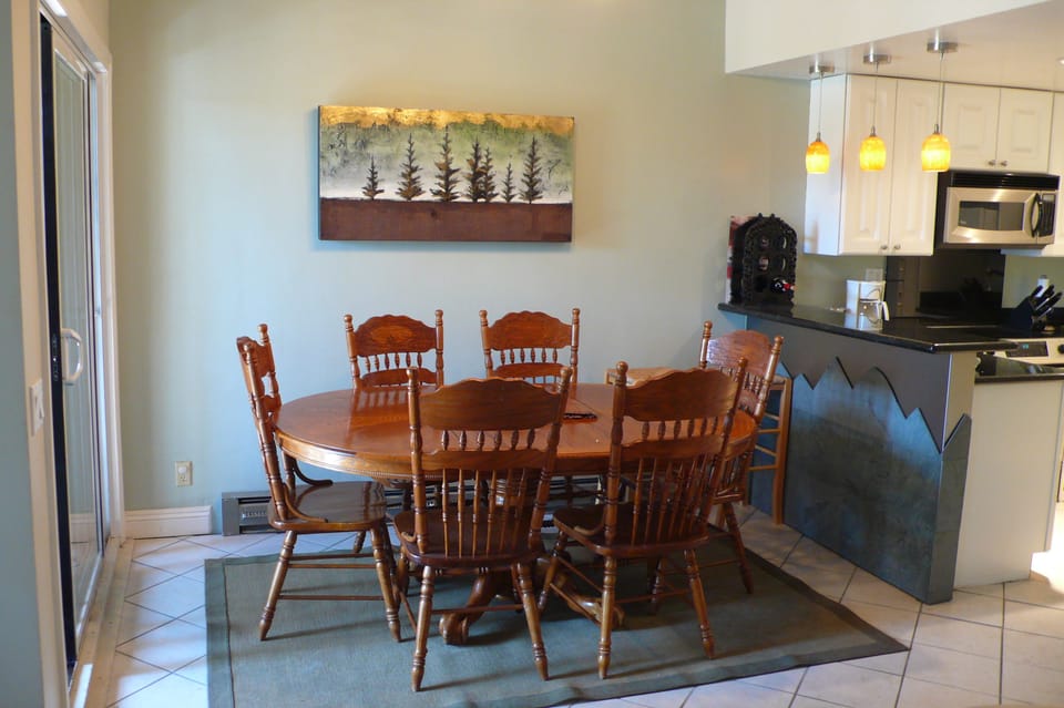 Dining-  Kitchen on right, deck with bbq on left. 