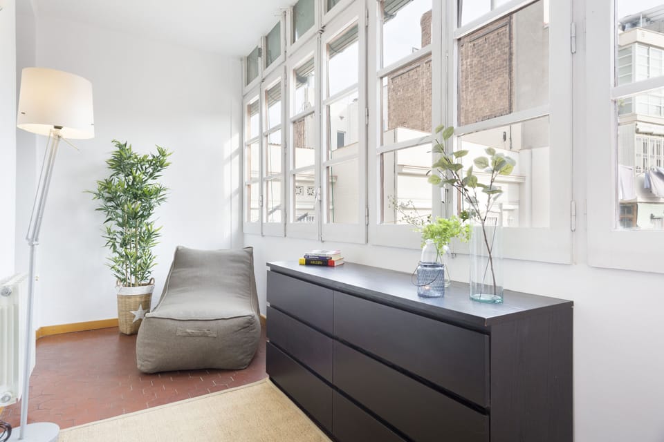 Enclosed balcony with seating