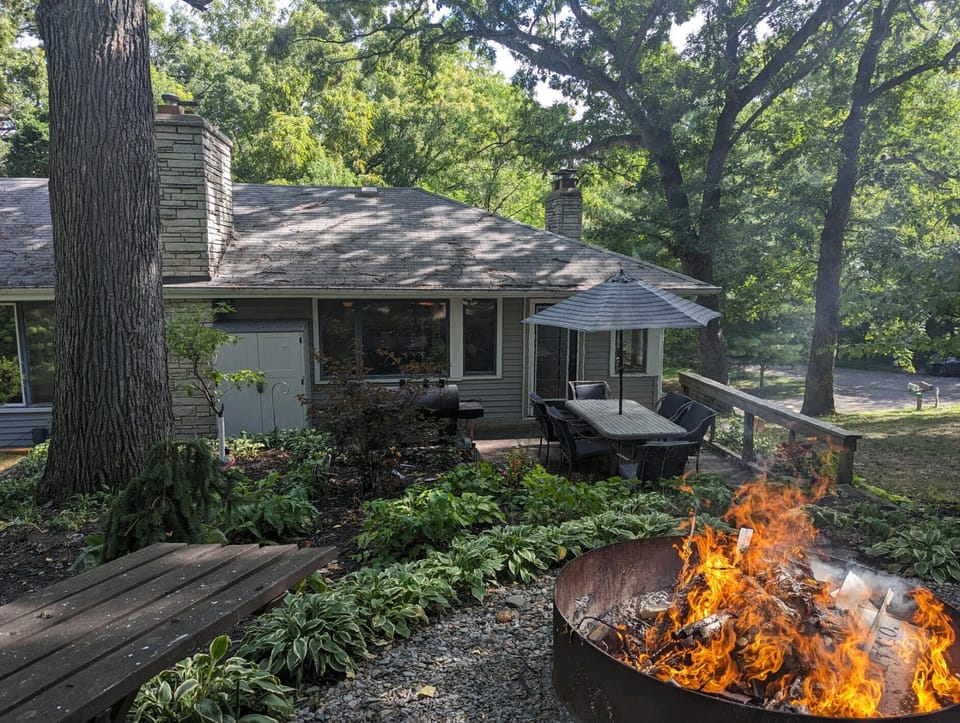Backyard Relaxation with Firepit & Bench.  Deck furniture removed during winter.