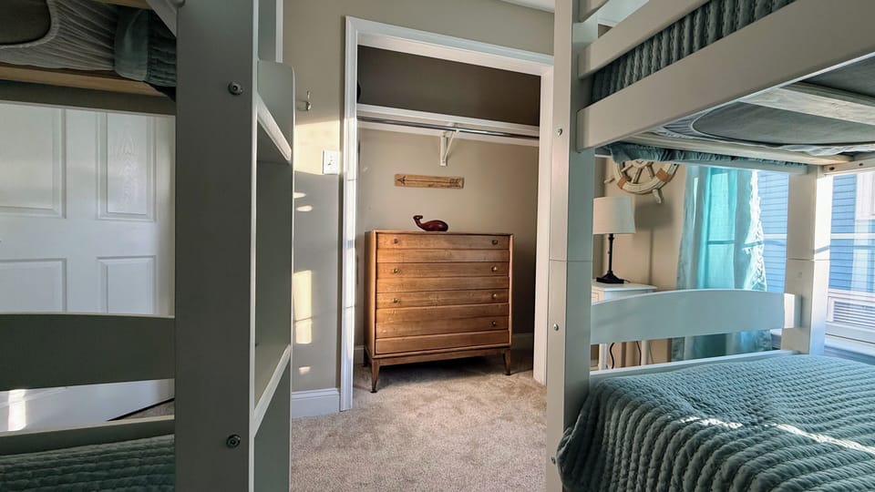 2nd Bedroom with closet, dresser, and 2 twin bunk beds