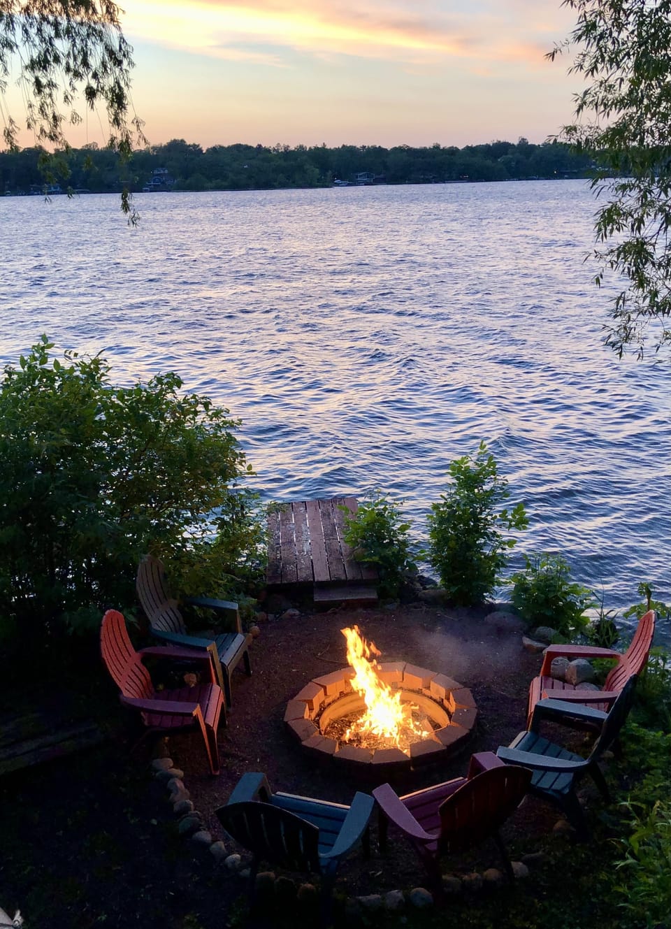 Enjoy the private fire pit and fishing pier with views of lake and sunset