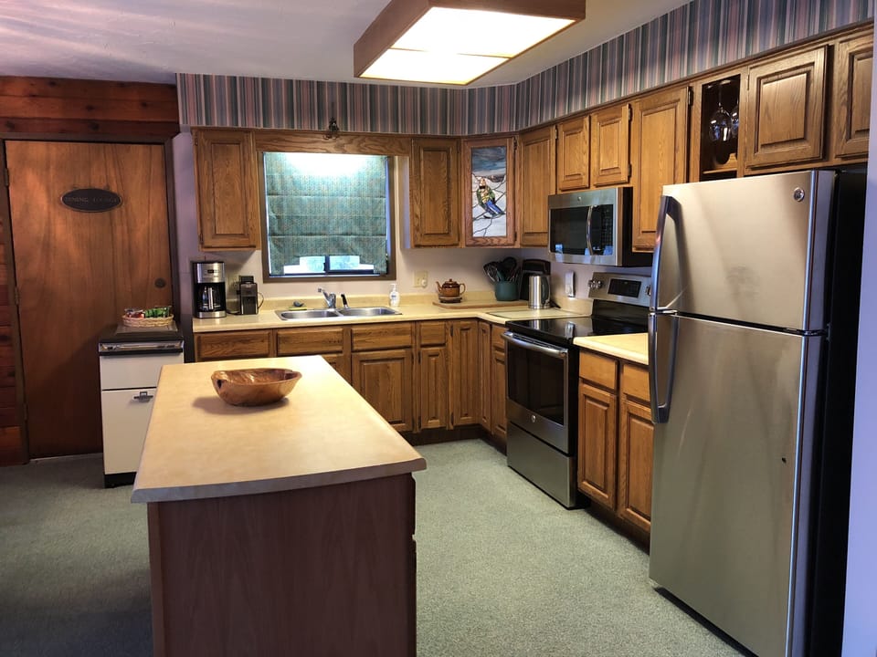 Kitchen with new stainless steel appliances. 