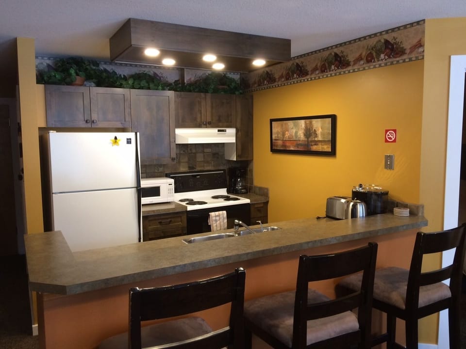 Full kitchen complete with DeLonghi espresso maker
