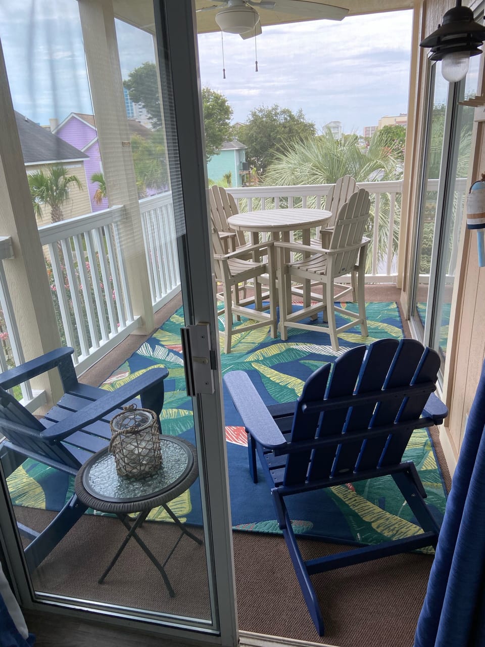 Screened Porch View from Primary Bedroom with Pollywood Furniture