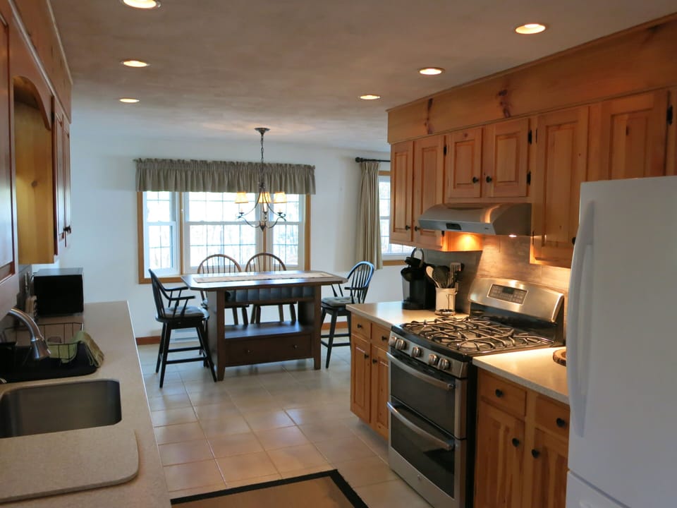 Recently renovated kitchen, large refrigerator and dining room seating for 6-8.