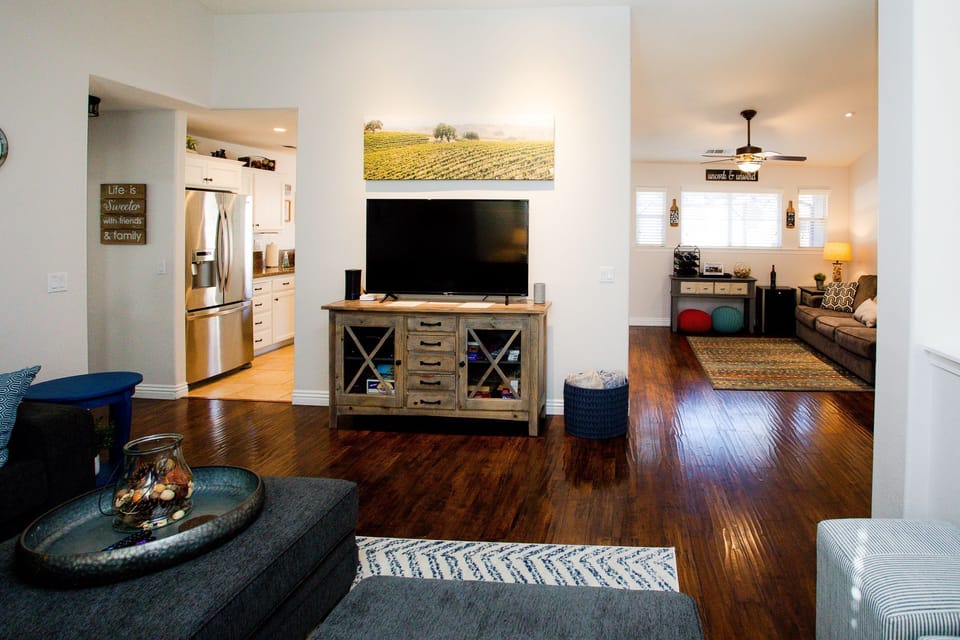 Flat screen tv with cable/Roku. Cabinet with games for all. Open to den area