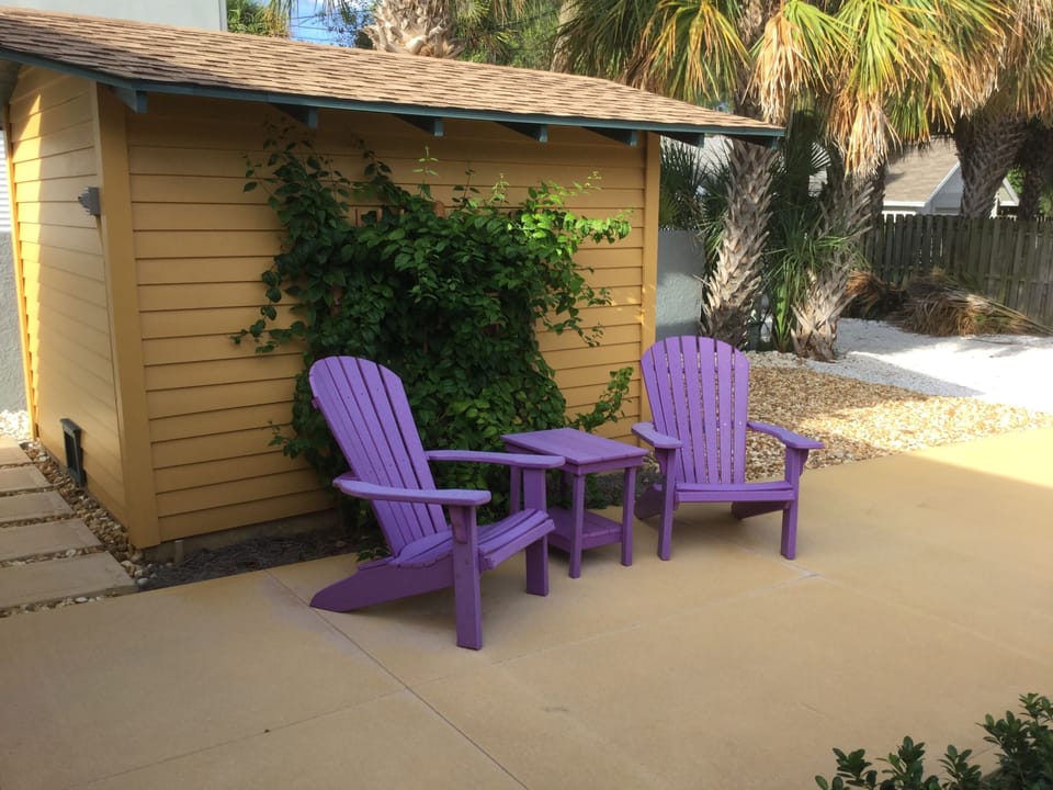 backyard seating area equipped with a grill
