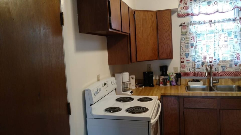 The kitchen offers a sink with a pull out faucet  for easy clean up as well as a dishwasher. We've stocked the cupboards and drawers with dishes and cutlery and many kitchen gadgets.