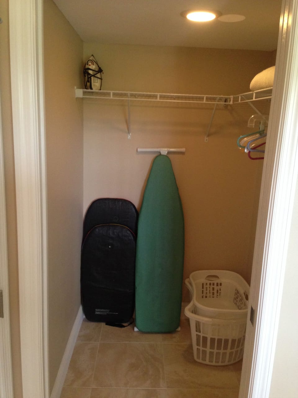 guest bedroom closet with boogie board (if available) and iron