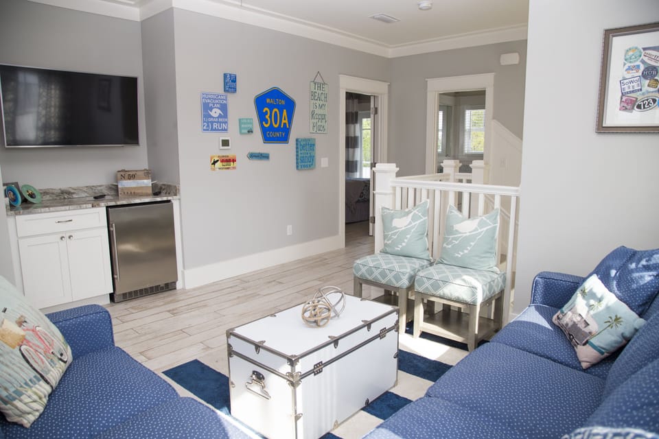 Third floor rec room, bedroom and bath offer a private space for young families.