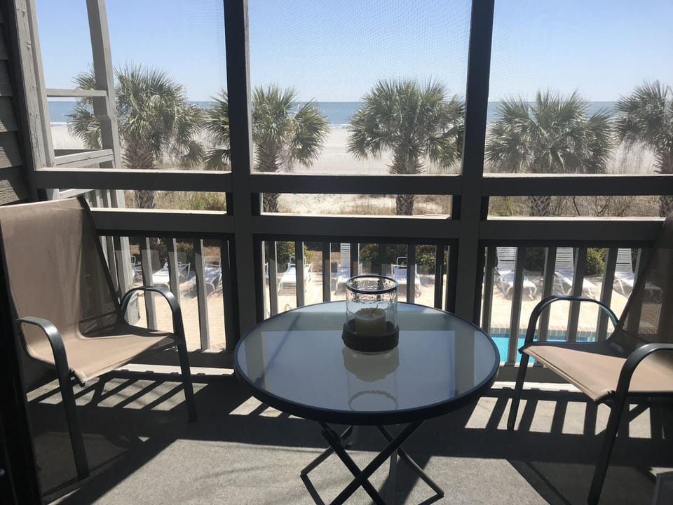 Sunny view from the screened porch.  Great place to enjoy coffee and breakfast!
