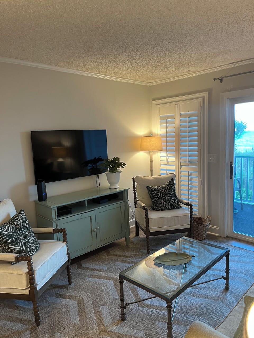 Living room with ocean view & screened porch.  Can dine outside.