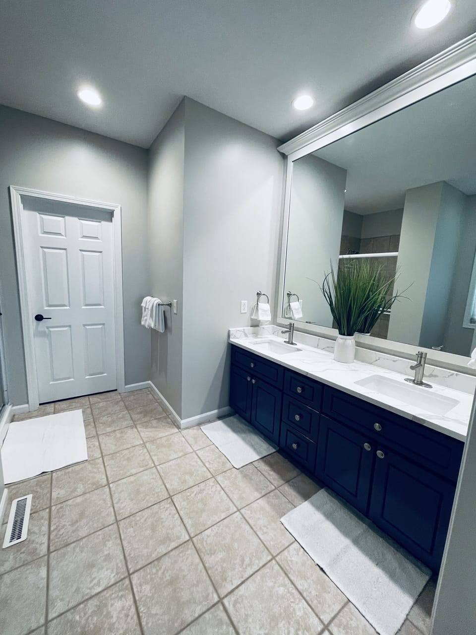 Master Bath featuring all new Quartz counter tops and tile shower.