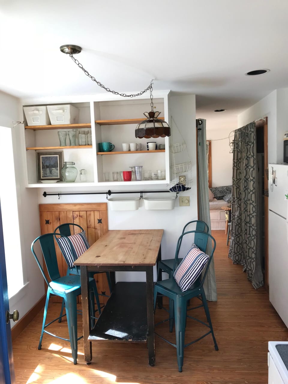 View of kitchen from front door, looking toward living room