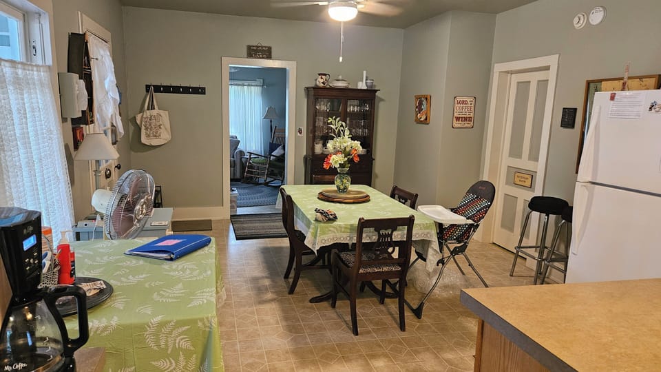 Kitchen dining area - from sink area. Doors to LR, bathroom and front porch.