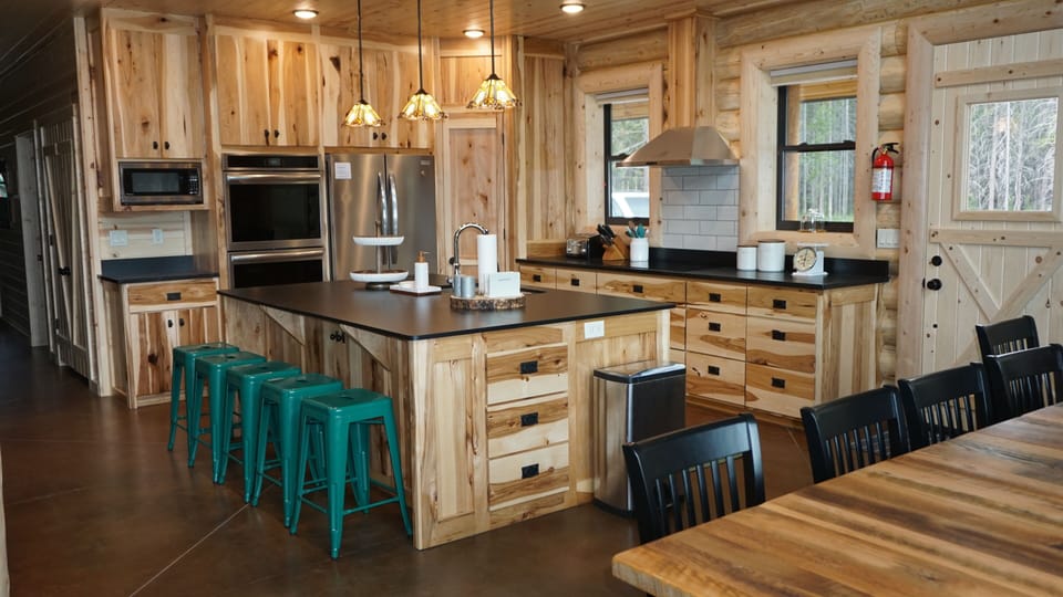 Kitchen: hickory cabinets, double oven, induction cooktop, granite counters