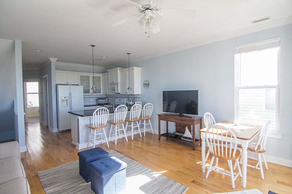 Fully stocked kitchen with dishwasher, coffee maker, microwave, dishes, etc.