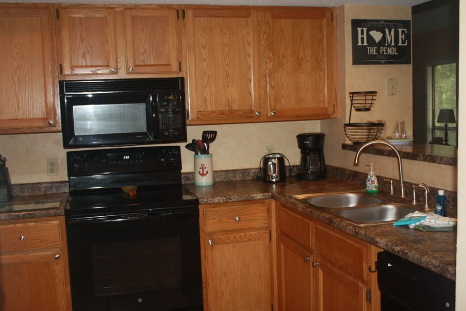 Kitchen with new stove and dishwasher