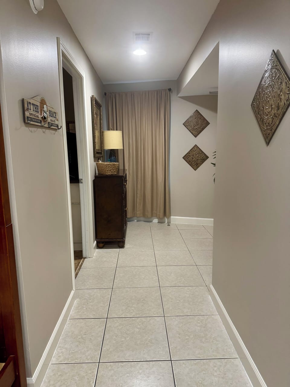 Condo hallway leading to master bedroom and bunks in the alcove. 