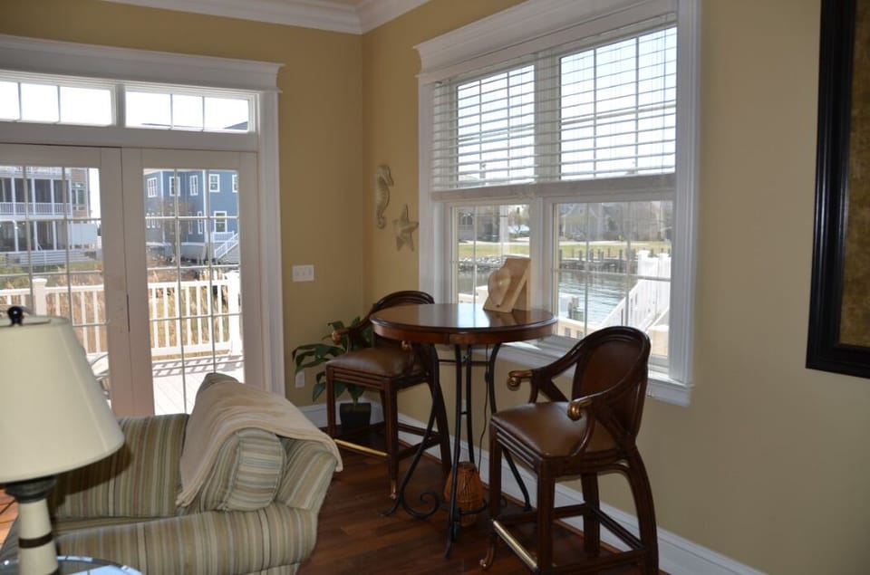 Views of dock and canal from family room bistro table