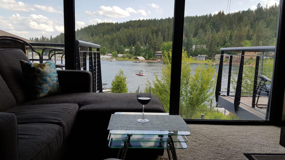 From the living room, you can gaze at the river as if you're sitting outside.