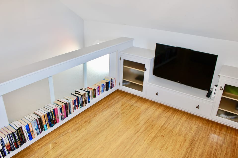 Second Floor Media Area with Wii, Books for All Ages, Yogiob Bean Bag, Futon. 