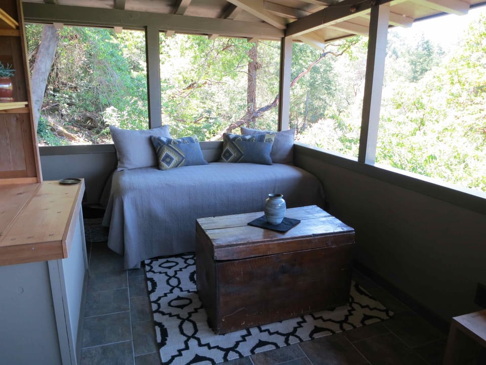 Daybed on the covered porch. Everybody's favorite place to sleep!