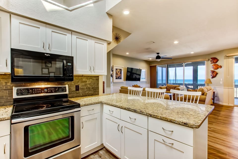 Kitchen bar area with view beyond to the ocean.