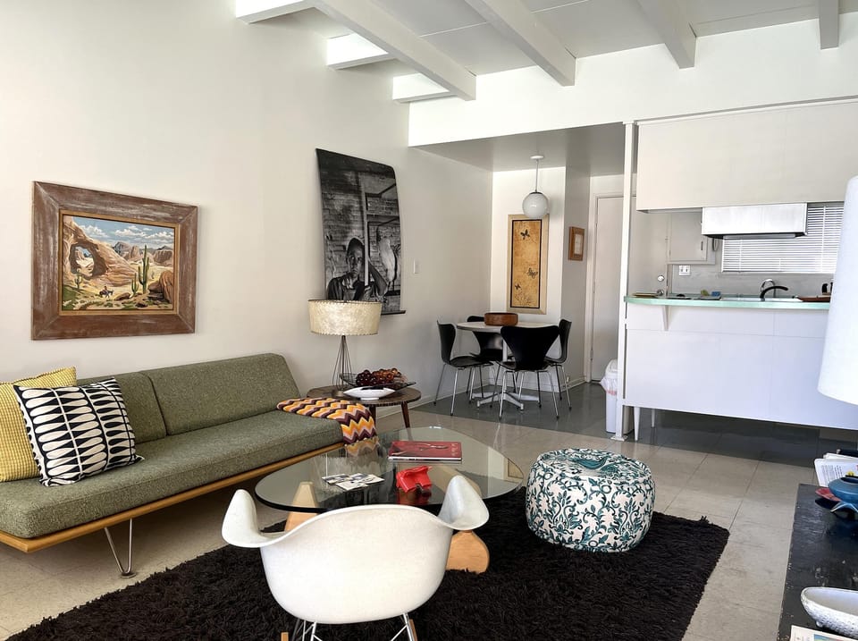 Bright and airy living room with modern kitchen access